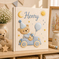 Personalized hand embroidered baby photo album featuring teddy bear driving a pastel blue vintage car with balloon, moon, stars, and sunshine accents