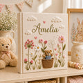 Personalized hand embroidered baby photo album with teddy bear basket wildflowers and cottagecore floral details