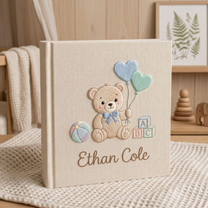Personalized hand embroidered photo album featuring a teddy bear holding heart-shaped balloons with alphabet blocks and custom baby name