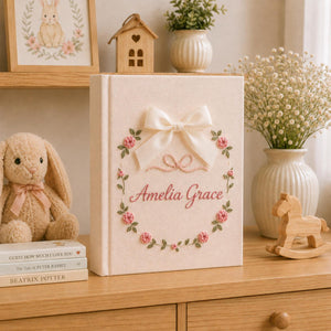 Personalized floral hand embroidered photo album with satin bow and pink rose wreath baby girl keepsake design