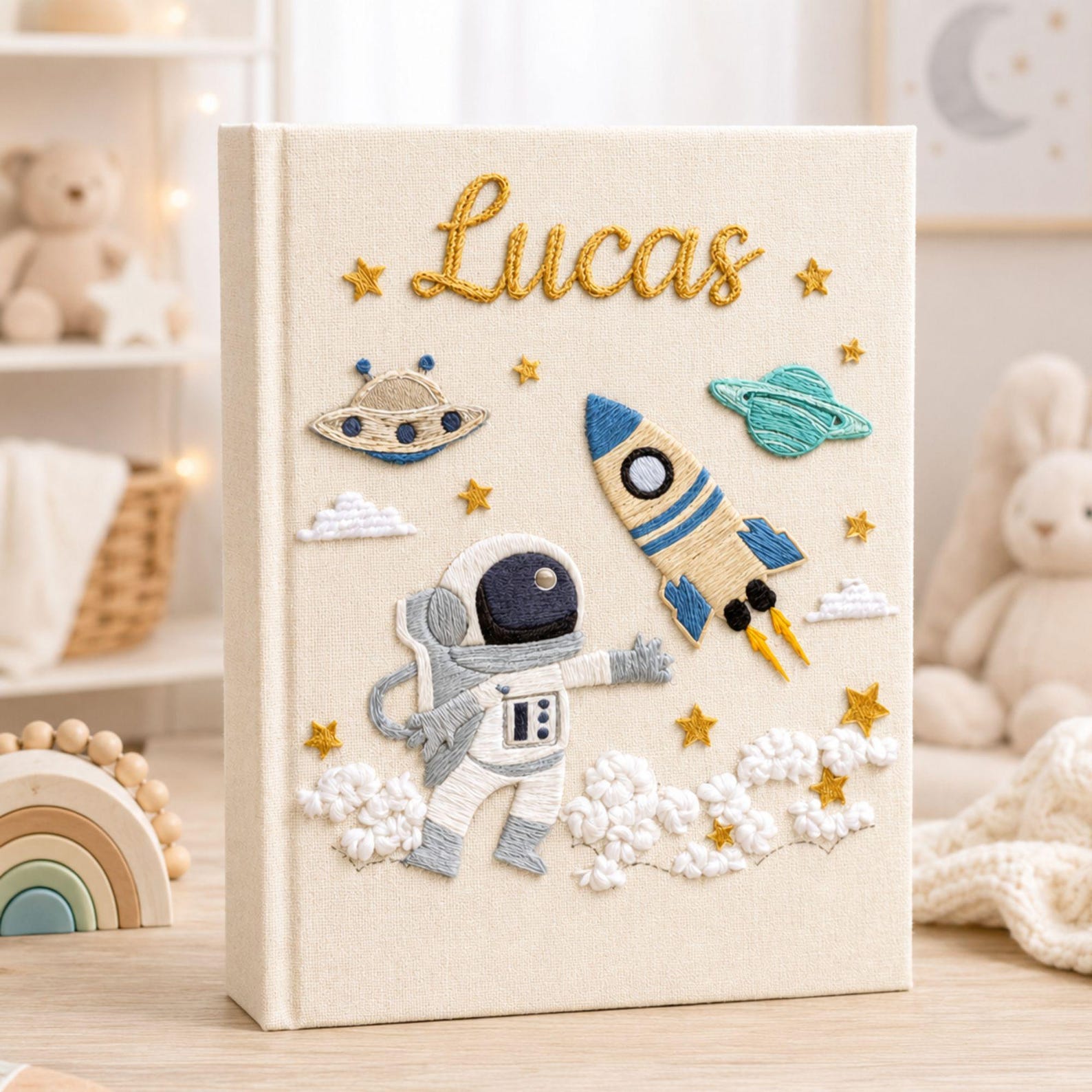 Personalized hand embroidered photo album featuring astronaut rocket planets stars and custom baby name on linen cover