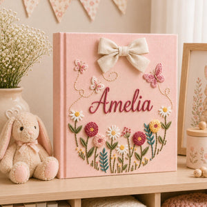 Personalized pink embroidered baby photo album with butterflies and colorful floral garden design