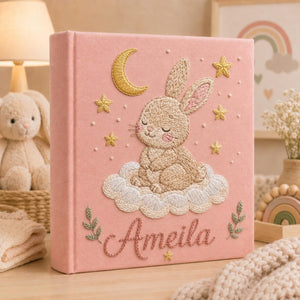 Personalized hand embroidered baby photo album with sleepy bunny, crescent moon, stars, and fluffy cloud embroidery details
