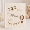 Personalized adventure hand embroidered baby photo album with airplane hot air balloon and cloud design on linen cover