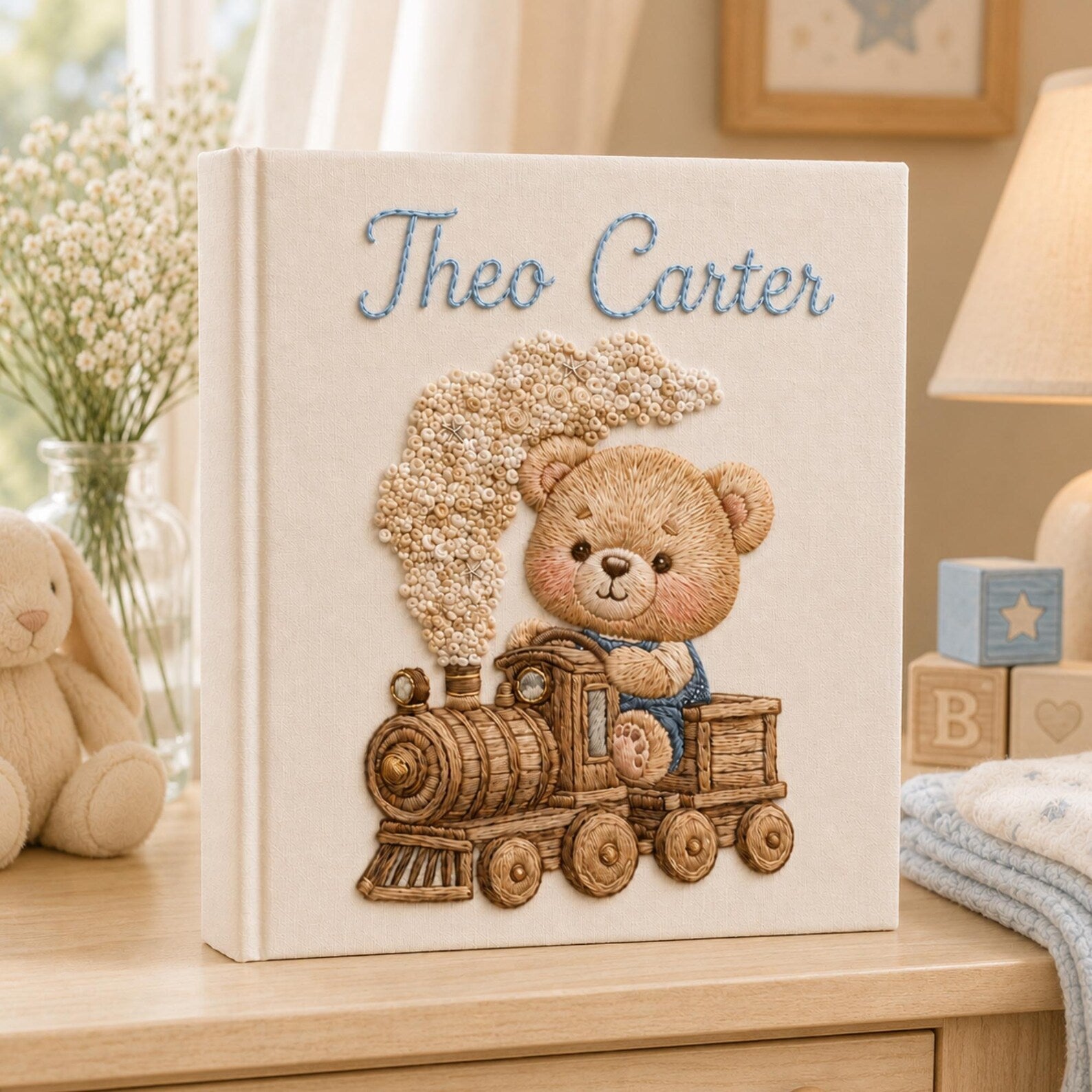 Personalized hand embroidered baby photo album with teddy bear riding a vintage steam train