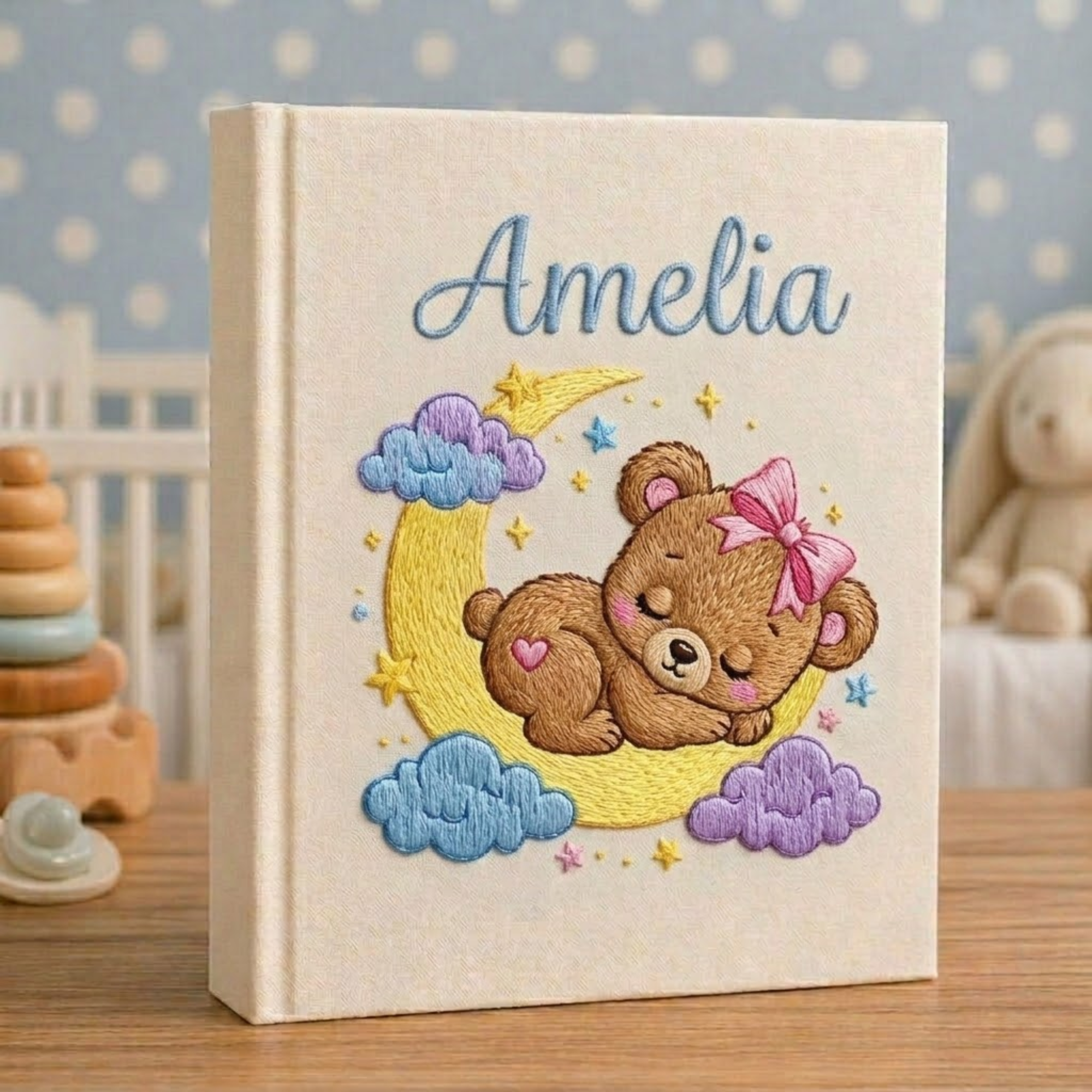 Personalized hand embroidered photo album featuring twinkling stars, pastel clouds, celestial nursery details and custom baby name embroidery