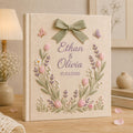 Personalized hand embroidered tulip floral wedding photo album with bow detail and custom couple names on linen cover