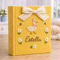 Personalized yellow hand embroidered baby photo album with duckling, daisies, and decorative bow