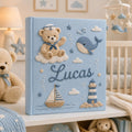 Personalized hand embroidered nautical baby photo album with sailor teddy bear, whale, sailboat, and lighthouse design