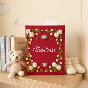 Personalized floral frame hand embroidered baby photo album with embroidered roses and greenery on berry red linen cover