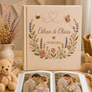 Personalized embroidered wedding photo album with pastel flowers lavender butterflies and custom couple names on linen cover