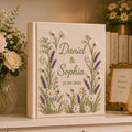 Personalized hand embroidered daisy lavender wedding photo album with botanical floral embroidery and custom names on linen cover
