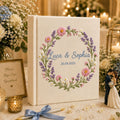 Personalized wildflower wreath hand embroidered photo album with custom names and wedding date on linen cover
