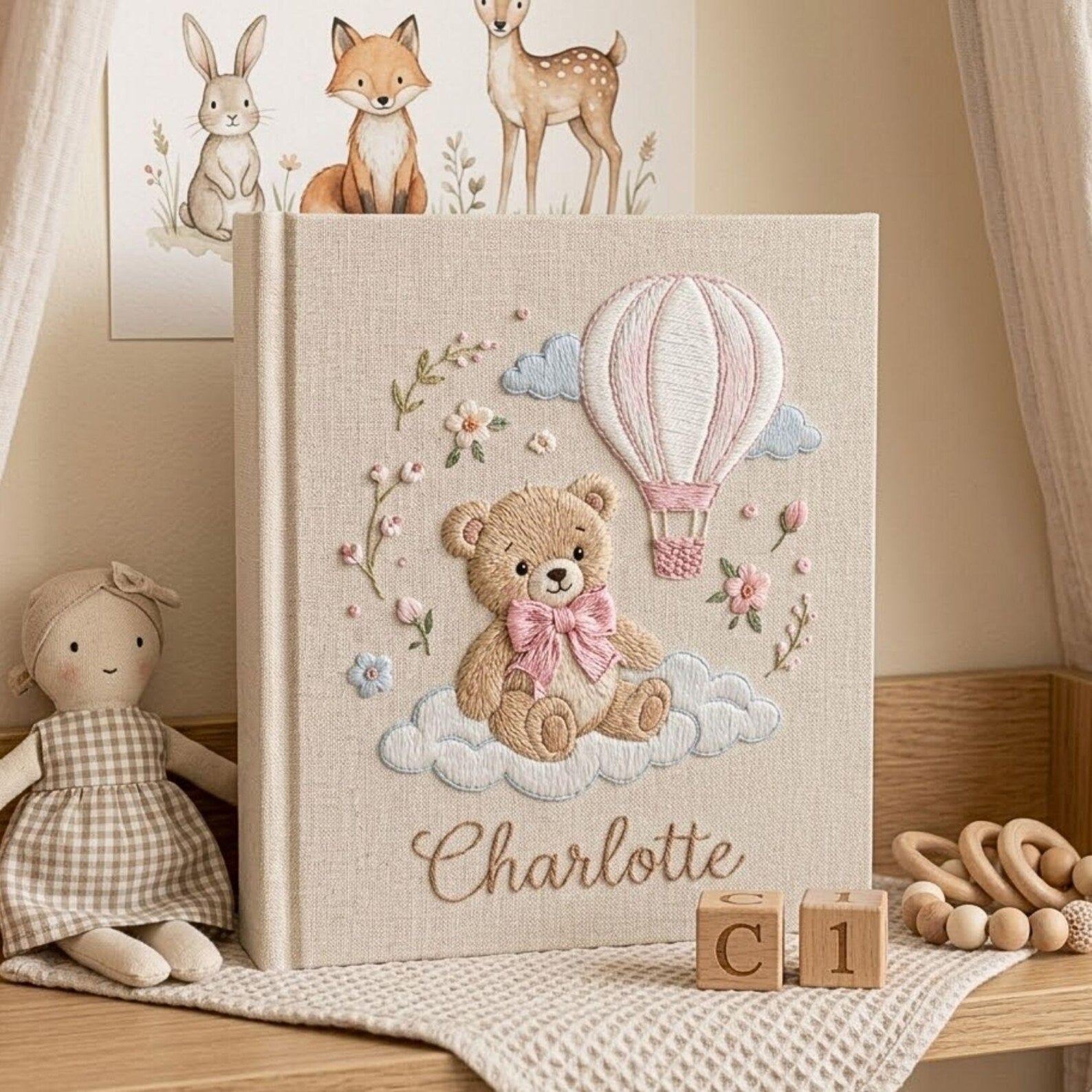 Personalized teddy hot air balloon embroidered baby photo album with pastel nursery design on linen cover