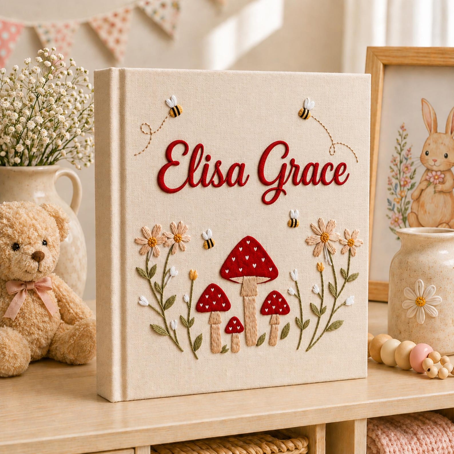 Personalized hand embroidered baby photo album with red mushrooms flowers and bees