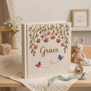 Personalized hanging floral butterfly hand embroidered baby photo album with botanical flower design on linen cover