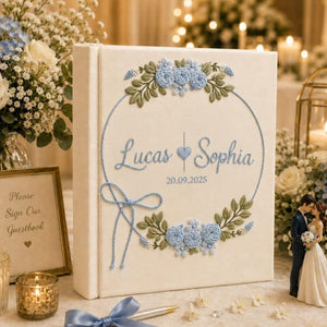 Personalized wedding photo album with blue floral wreath embroidery custom couple names and wedding date on linen cover