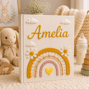 Personalized rainbow hand embroidered photo album with daisy flowers and pastel nursery keepsake design