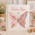 Personalized hand embroidered photo album featuring a floral butterfly with pink wildflowers, lavender accents, and custom name embroidery on a premium linen cover