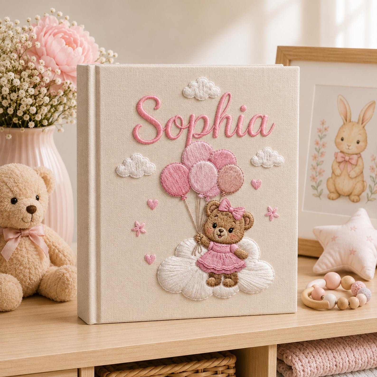 Personalized hand embroidered baby photo album with teddy bear holding pink balloons on clouds