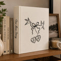 Personalized embroidered wedding photo album with minimalist birds ribbon hearts and custom initials on linen cover