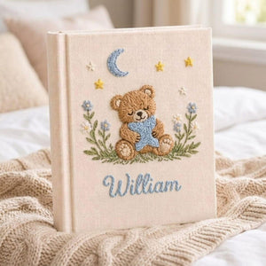 Personalized sleepy teddy hand embroidered baby photo album with moon star and bedtime nursery design on linen cover