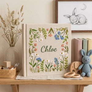 Personalized wildflower garden hand embroidered baby photo album with botanical floral meadow design on linen cover