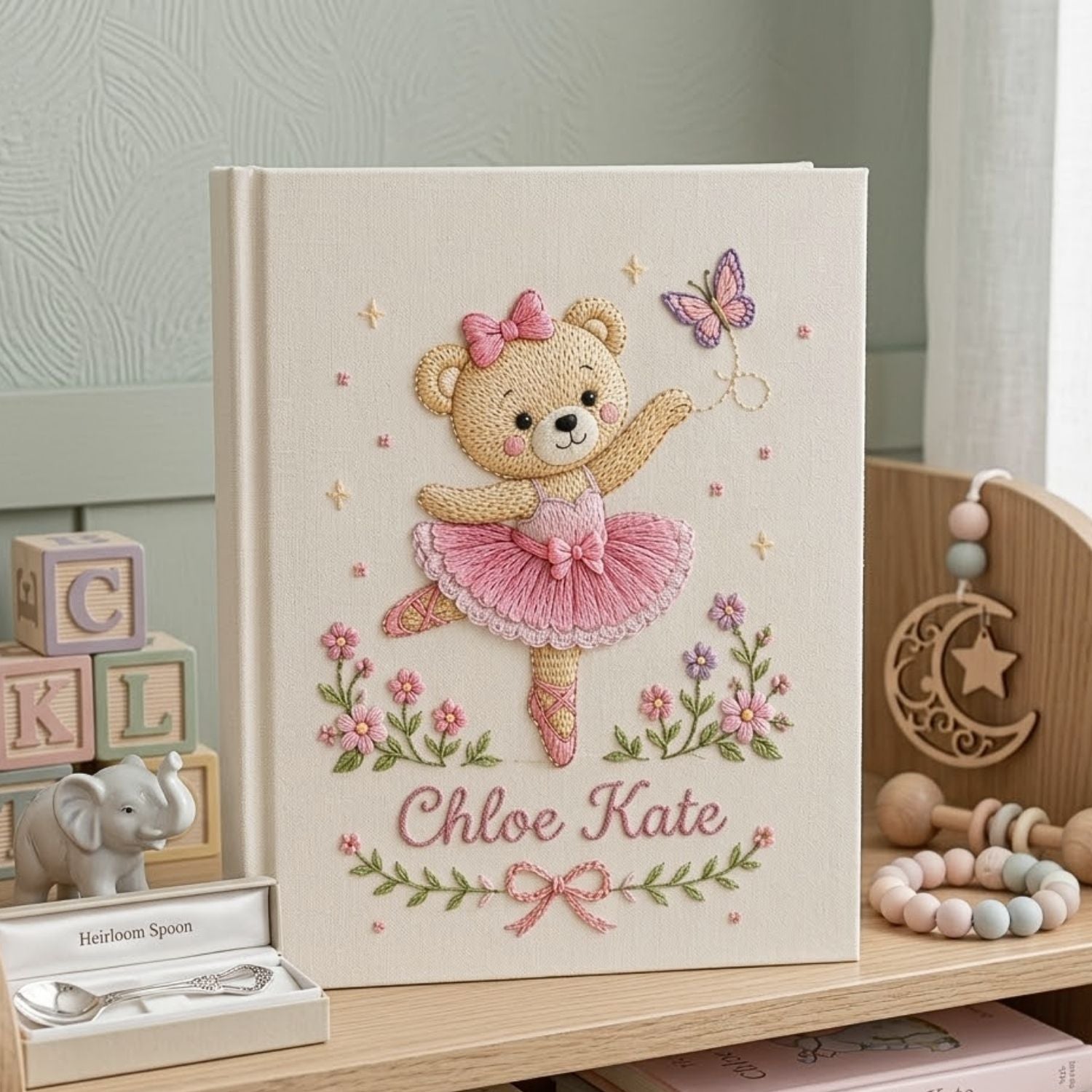 Personalized hand embroidered photo album featuring a ballerina teddy bear in a pink tutu dancing with a butterfly and floral accents