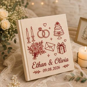 Personalized embroidered wedding photo album with wedding rings, cake, candles, flowers, custom names, and wedding date on linen hardcover
