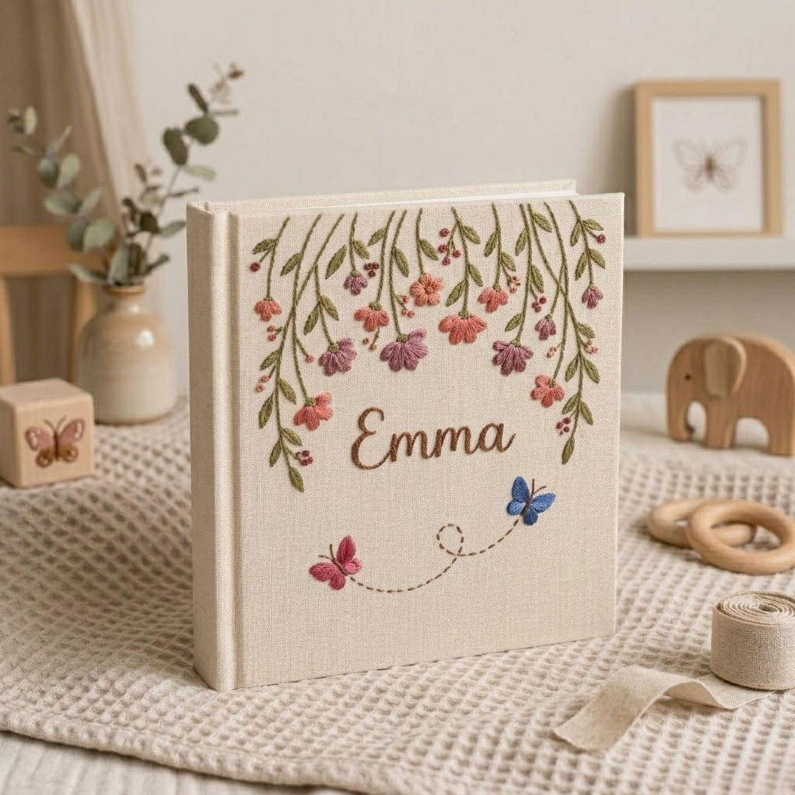 Personalized hanging floral butterfly hand embroidered baby photo album with botanical flower design on linen cover