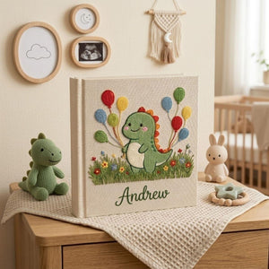 Personalized dinosaur hand embroidered baby photo album with colorful balloons and custom name on linen cover