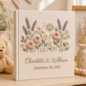 Personalized embroidered wedding photo album with pastel wildflowers, lavender floral embroidery, custom couple names, wedding date, and elegant linen hardcover design