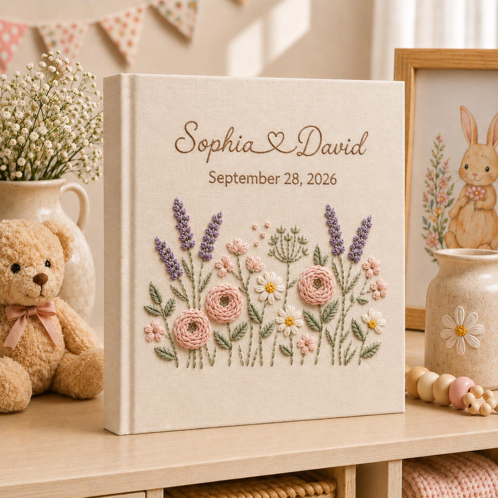 Collection of personalized hand embroidered floral wedding photo albums with botanical embroidery, custom couple names, and romantic linen covers