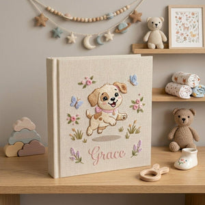 Personalized embroidered baby photo album with cute puppy, butterflies, pastel flowers, and custom name embroidery