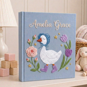Personalized hand embroidered photo album featuring a bonnet goose walking through a whimsical storybook flower garden