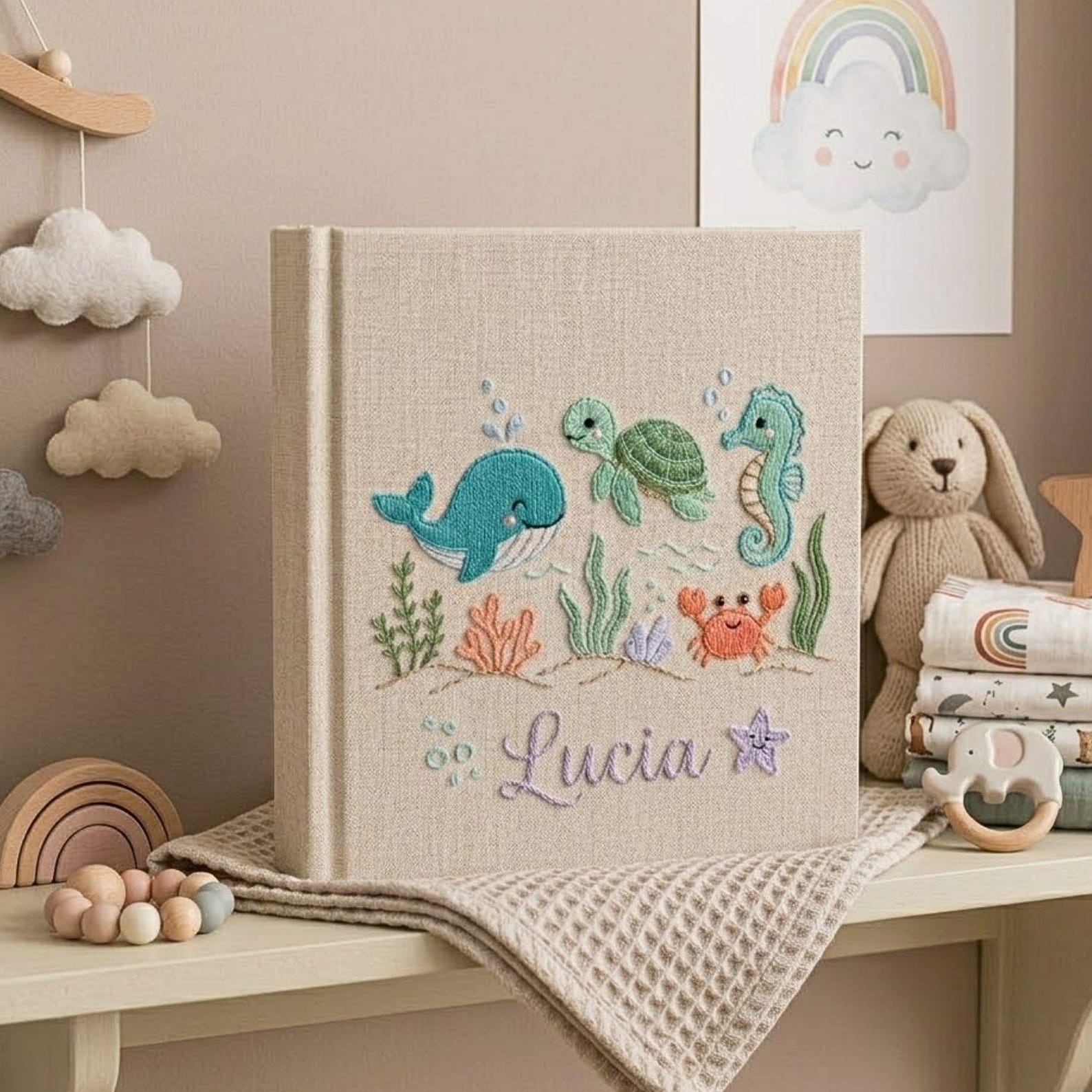 Personalized embroidered baby photo album with whale, turtle, seahorse, crab, ocean plants, and custom name embroidery