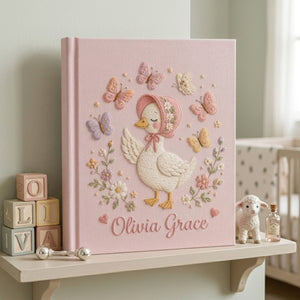 Personalized hand embroidered photo album featuring a cottage style goose wearing a floral bonnet surrounded by butterflies and flowers