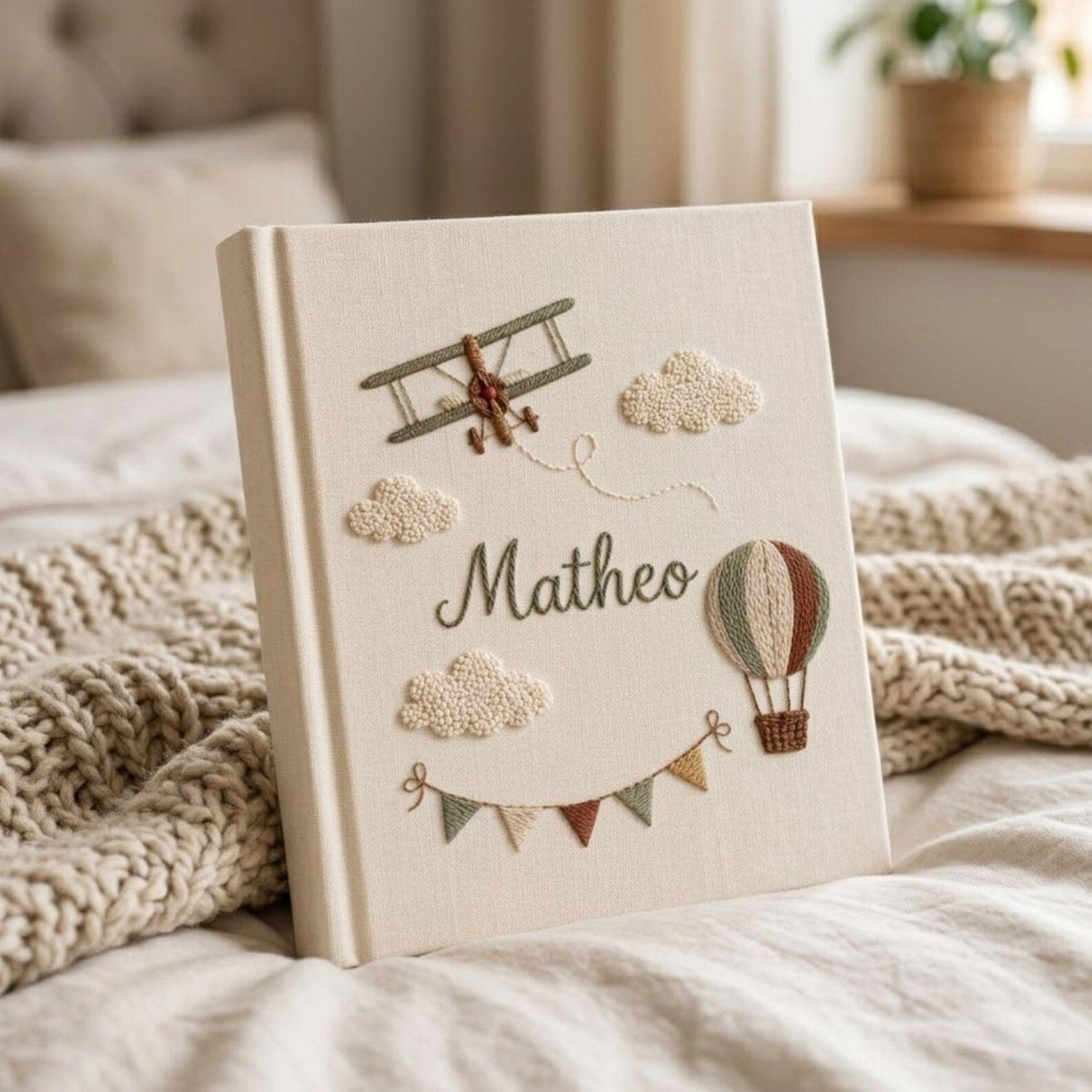 Personalized adventure hand embroidered baby photo album with airplane hot air balloon and cloud design on linen cover