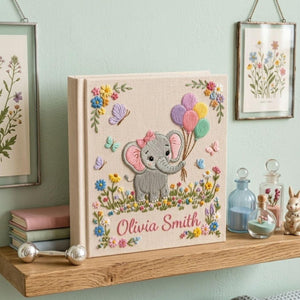 Personalized hand embroidered photo album featuring cute elephant holding colorful balloons surrounded by flowers butterflies and custom name embroidery