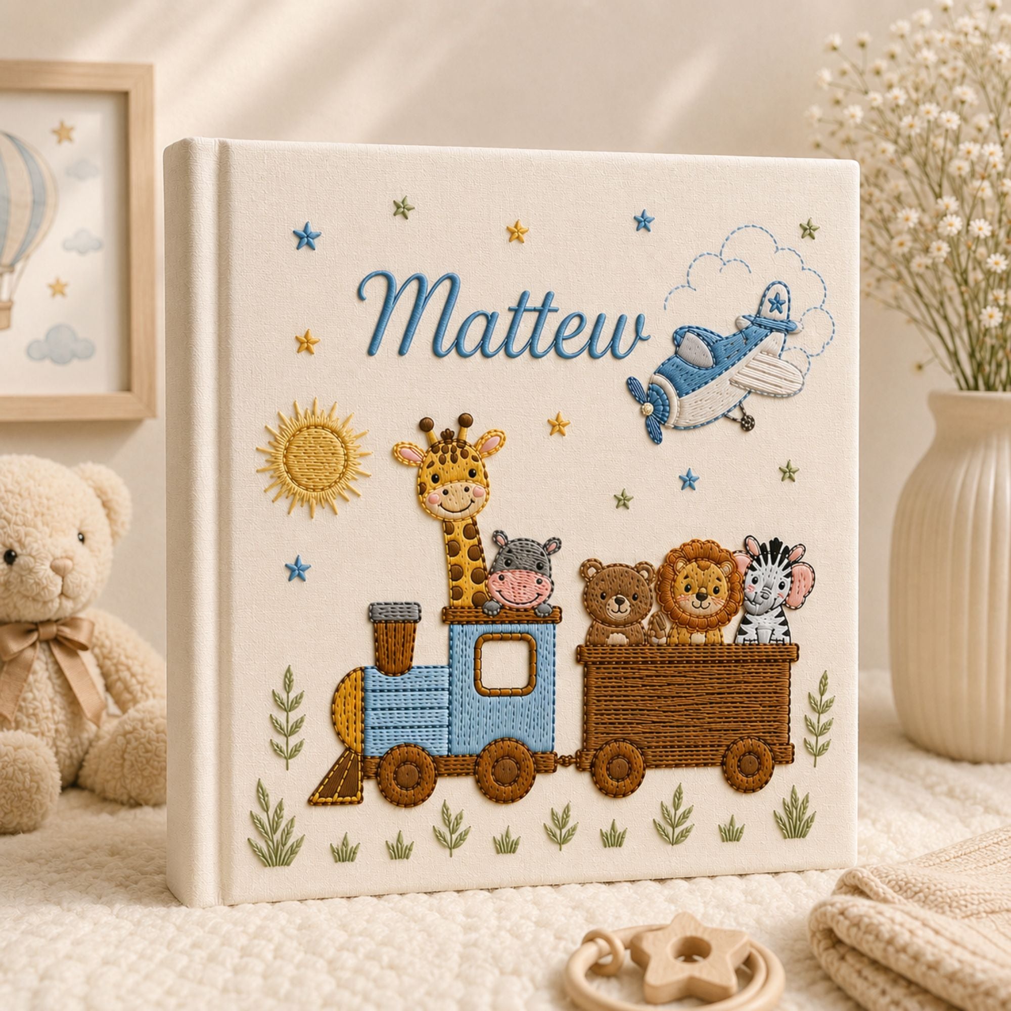 Personalized hand embroidered photo album featuring an adventure train with animal friends, stars, clouds and vintage airplane