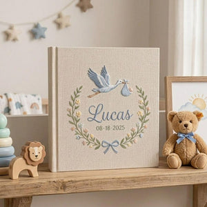 Personalized stork birth announcement embroidered baby photo album with custom name and birth date on linen cover