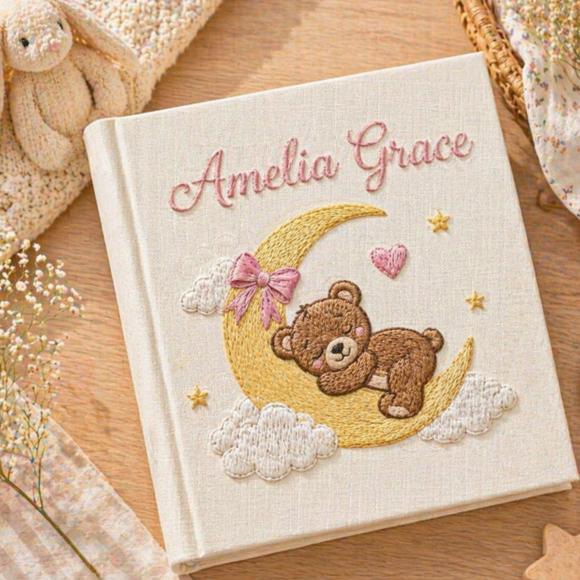 Personalized hand embroidered photo album featuring a sleeping teddy bear resting on a crescent moon with clouds and golden stars