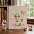 Personalized adventure travel hand embroidered baby photo album with hot air balloon airplane and teddy bear design on linen cover