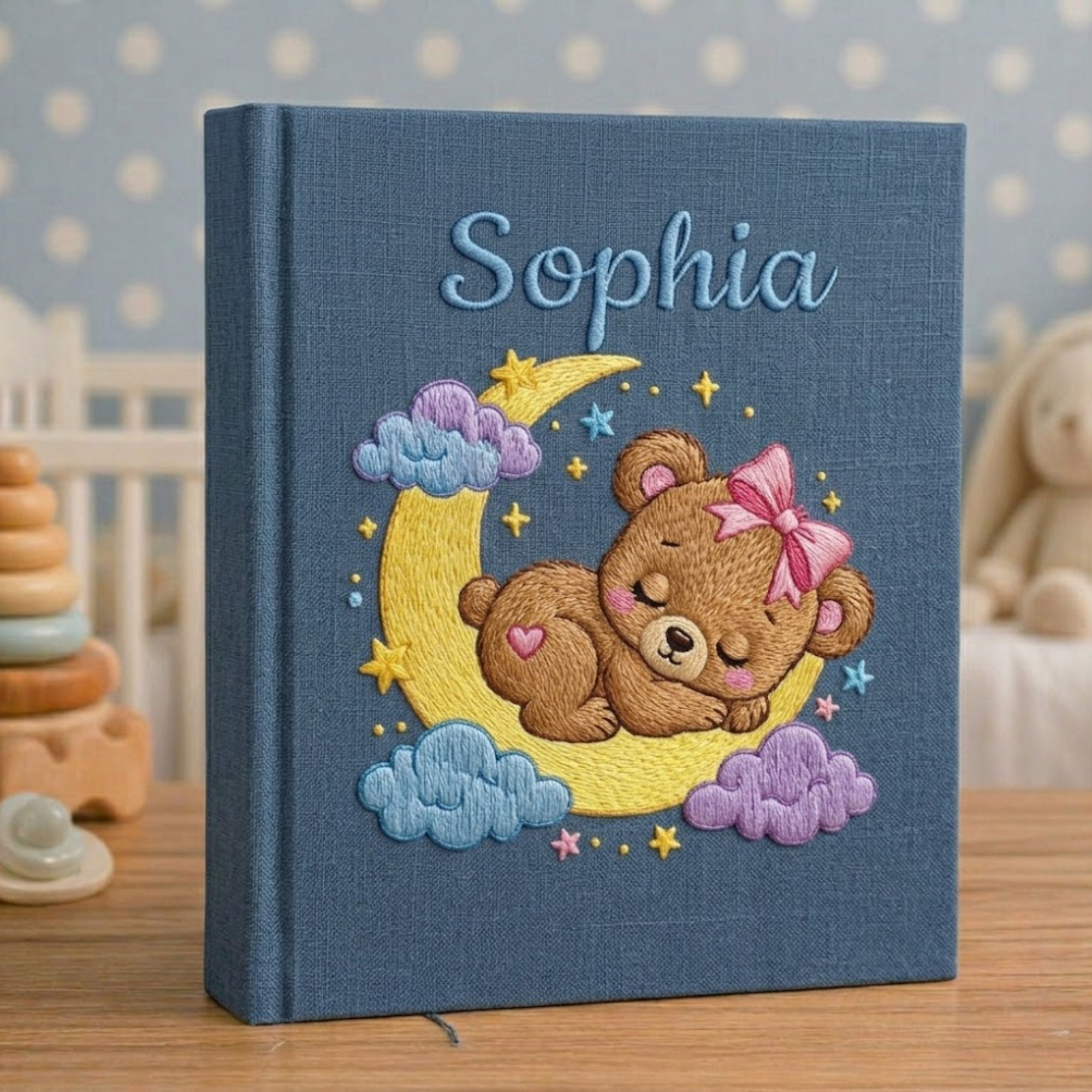 Personalized hand embroidered photo album featuring twinkling stars, pastel clouds, celestial nursery details and custom baby name embroidery