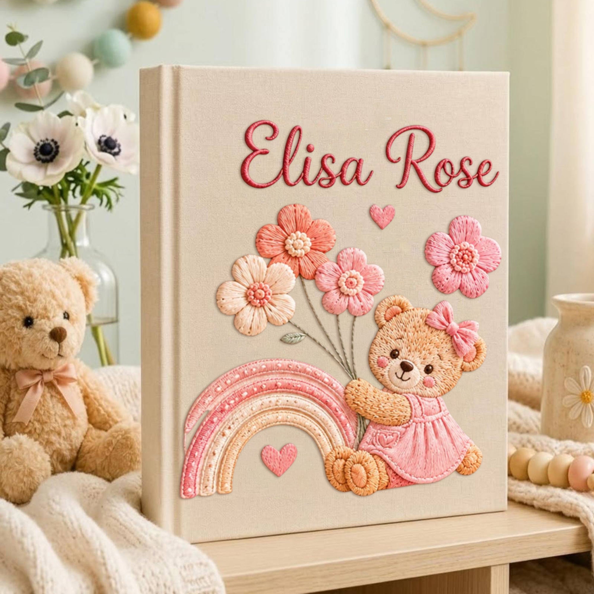 Personalized hand embroidered baby photo album with teddy bear, pastel rainbow, and pink floral embroidery