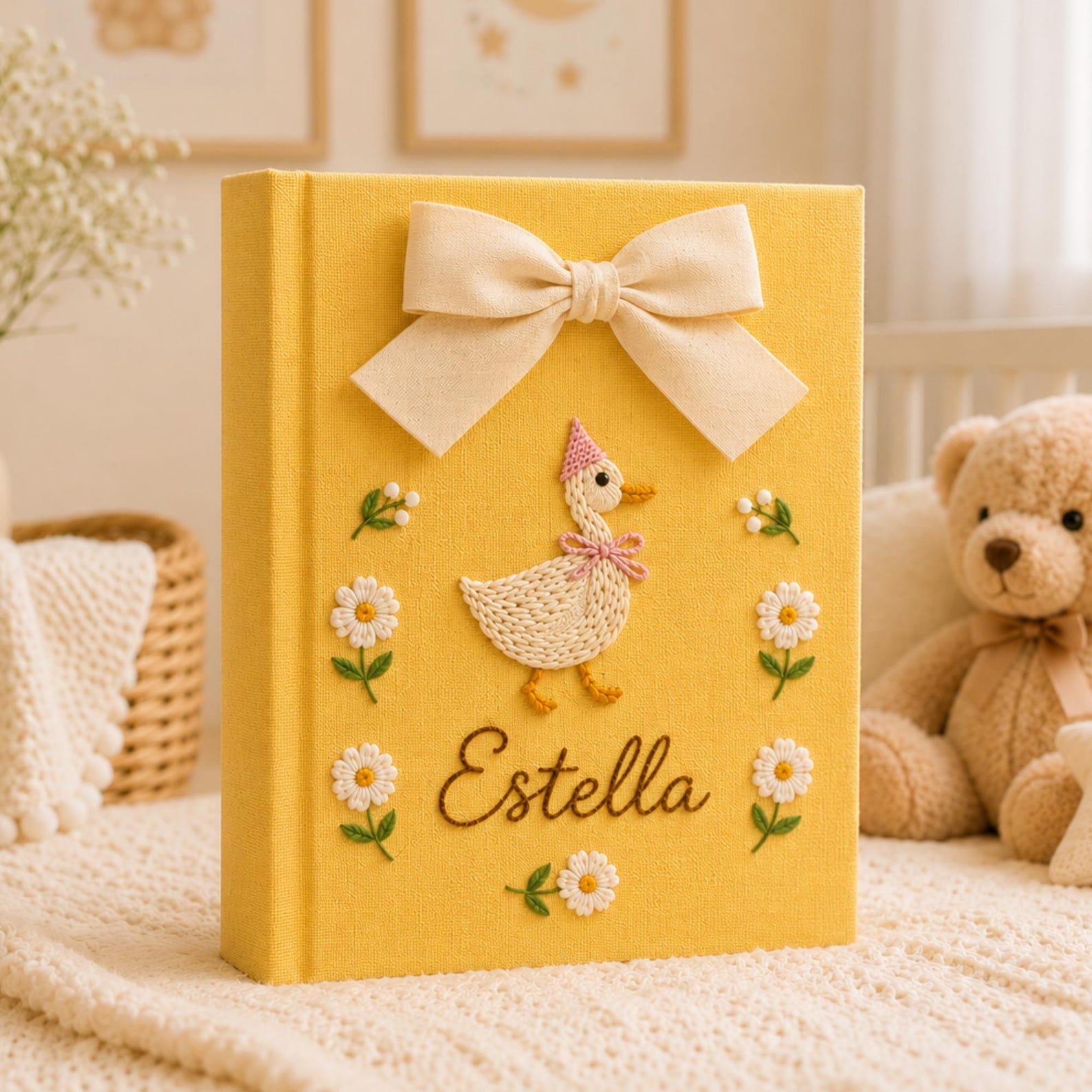 Personalized yellow hand embroidered baby photo album with duckling, daisies, and decorative bow