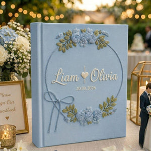Personalized wedding photo album with blue floral wreath embroidery custom couple names and wedding date on linen cover