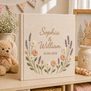 Personalized wildflower embroidered wedding album with lavender stems, pastel daisies, and custom couple names on a linen fabric cover