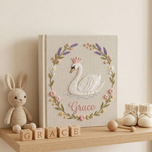 Personalized swan princess hand embroidered baby photo album with floral wreath nursery design on linen cover