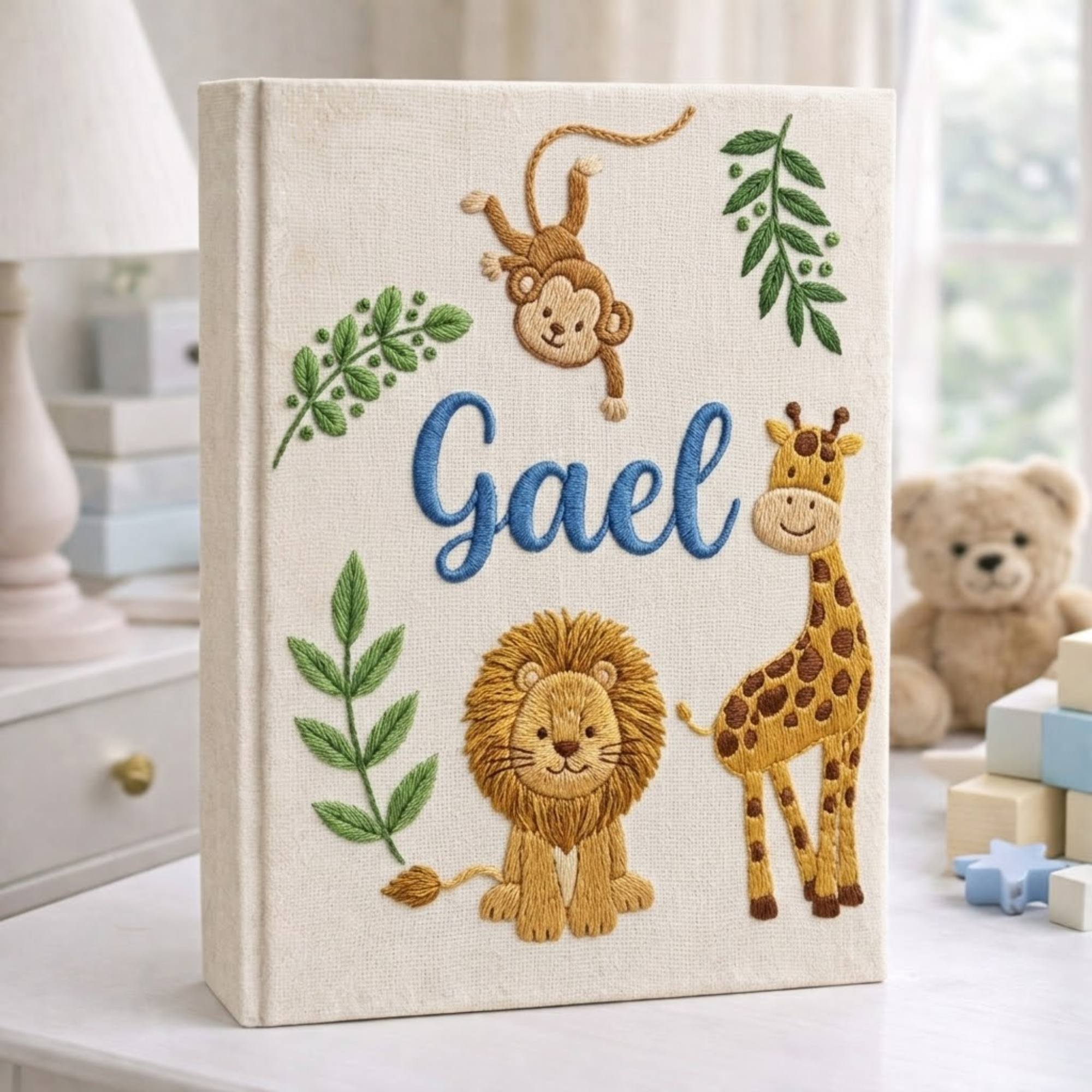 Personalized hand embroidered photo album featuring safari animals and custom birth statistics including weight, length, and birth time